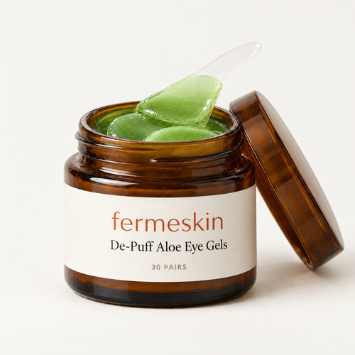 Fermeskin De-Puff Aloe Eye Gels jar open with green gel patches