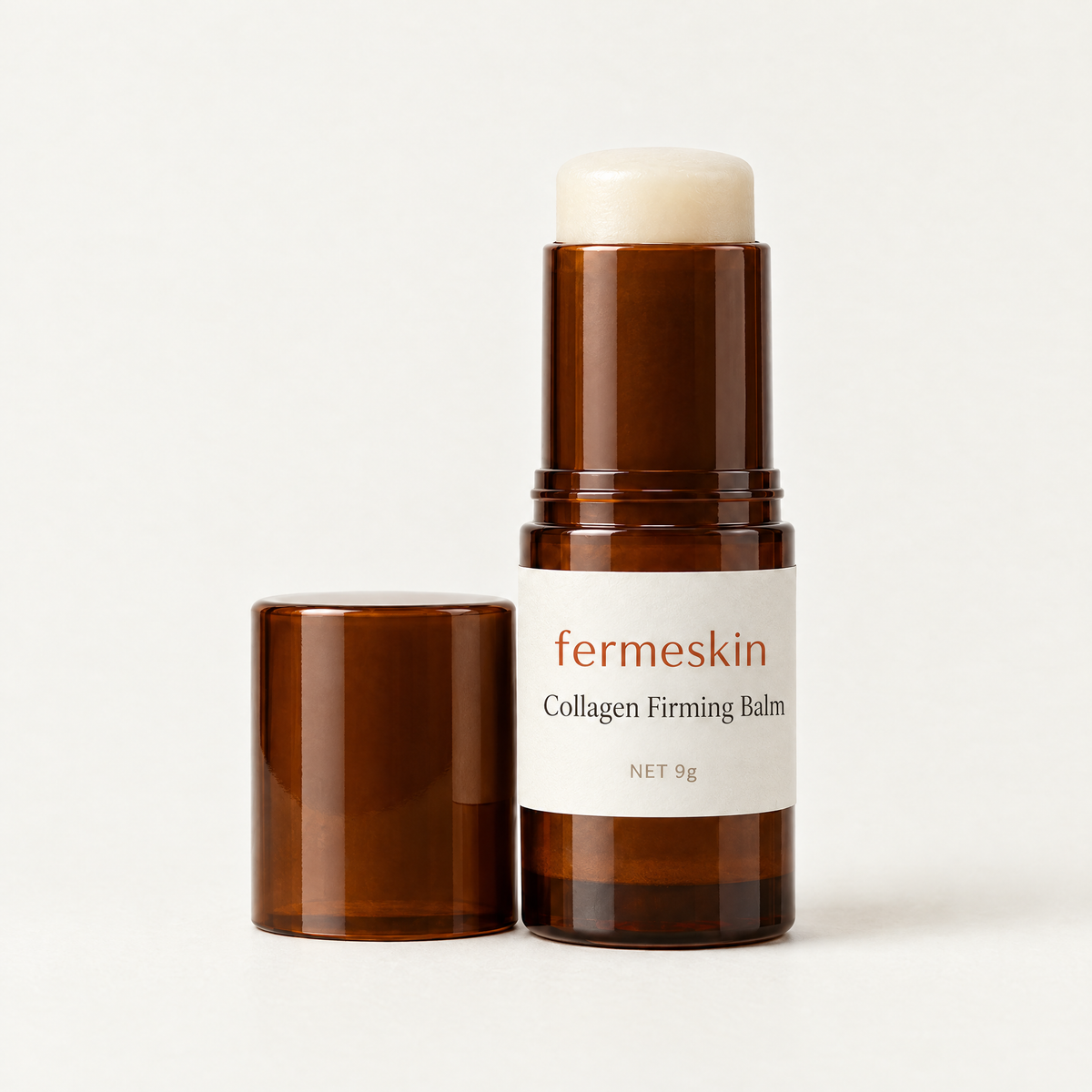 Fermeskin Collagen Firming Balm stick in amber with cap off